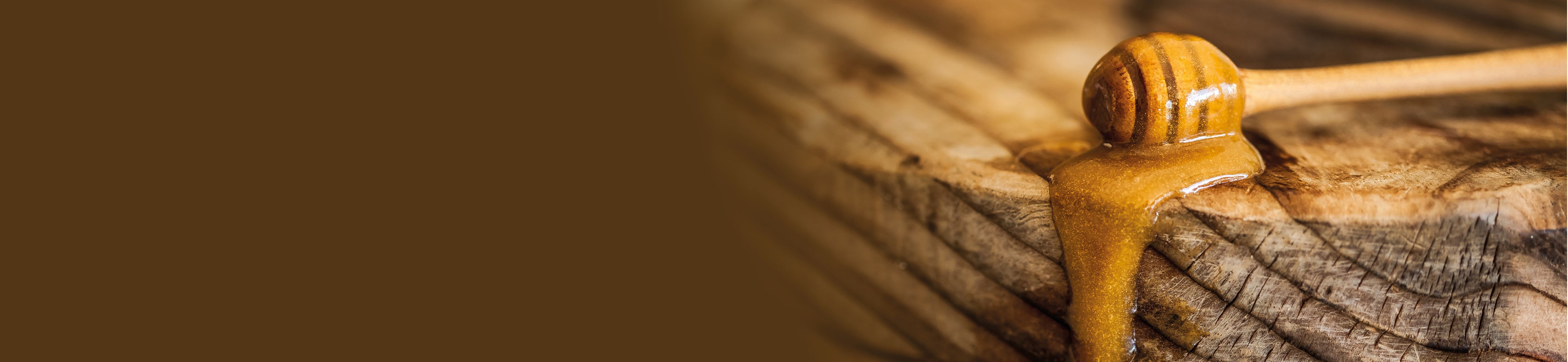 manuka honey drizzling from a wand